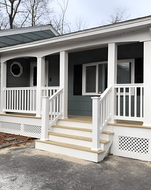 152221015_361875871651479_7429226262117313881_n (1) Front porch with white railings and steps.