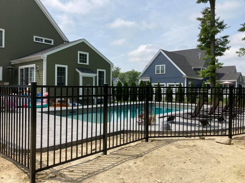 470493266_1442679126904476_7507714958312978793_n Fenced backyard pool with lounge chairs.