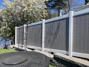 Patio with fence and blooming tree.